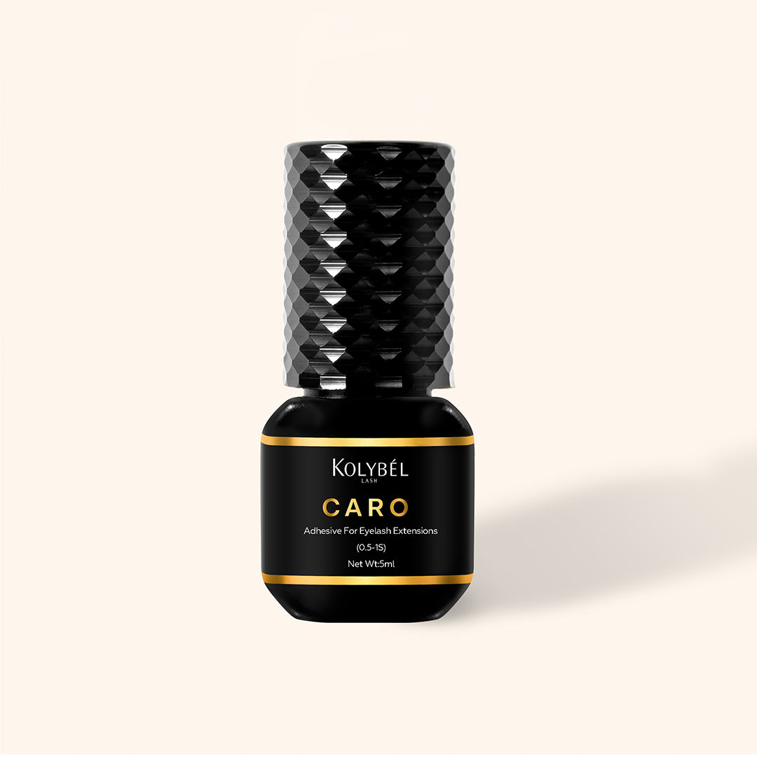 0.5-1 Second CARO Adhesive Eyelash Extension Glue (5ml) - Kolybel-This professional eyelash extension adhesive offers ultra-fast 0.5–1 second drying for efficient lash application and long-lasting wear. Its strong, semi-permanent bond provides up to 7–8 weeks of retention with a glossy black finish for a defined lash line.