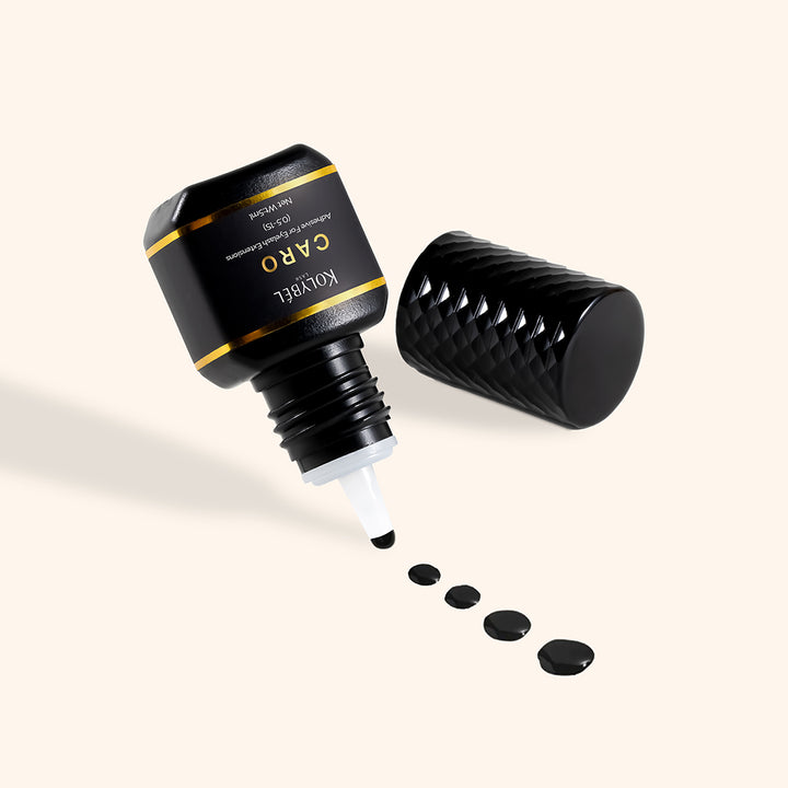 0.5-1 Second CARO Adhesive Eyelash Extension Glue (5ml) - Kolybel-This professional eyelash extension adhesive offers ultra-fast 0.5–1 second drying for efficient lash application and long-lasting wear. Its strong, semi-permanent bond provides up to 7–8 weeks of retention with a glossy black finish for a defined lash line.
